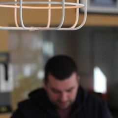 Steve stood under a light